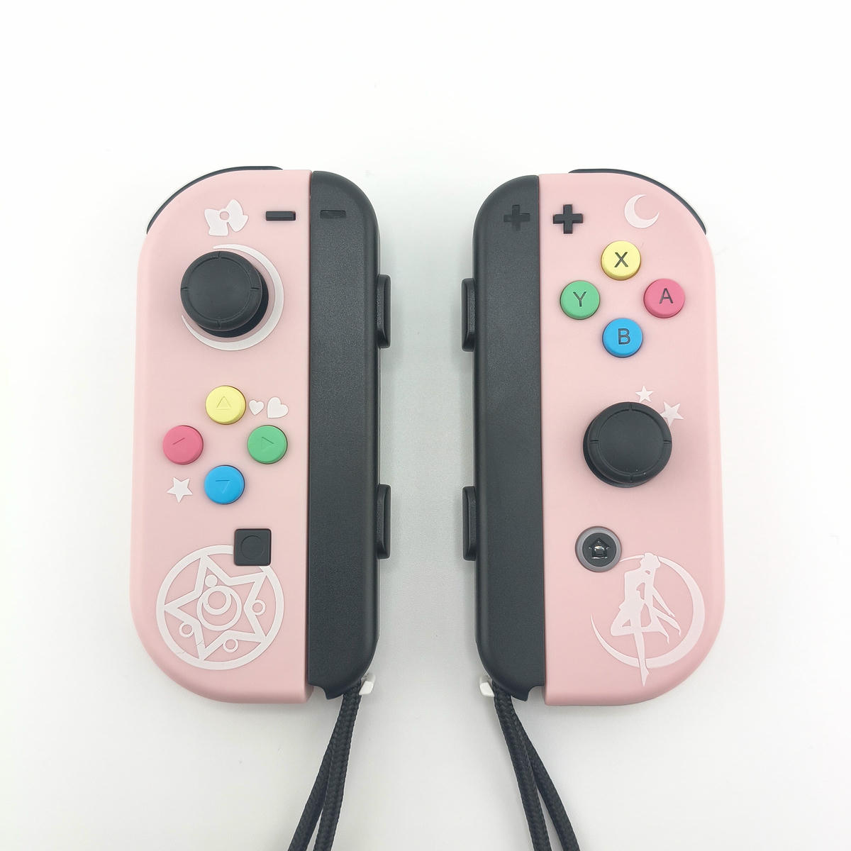 Coppia di controller wireless Soamide compatibili con Switch, edizione speciale Dreamy Pastel in rosa e lilla con icone celestiali.