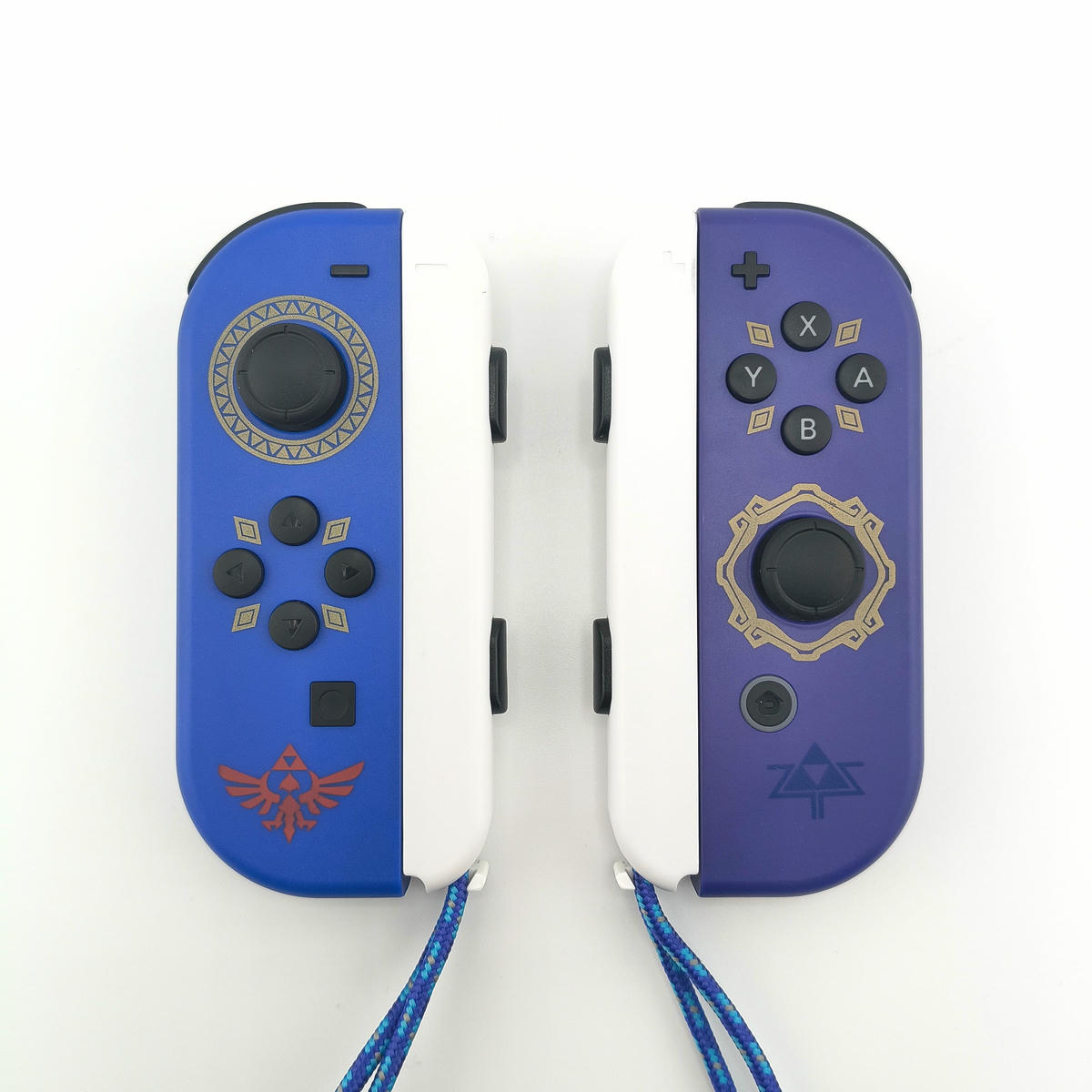 Set di controller wireless Soamide compatibili con console Switch, design blu e viola con motivi dorati, completi di supporti.
